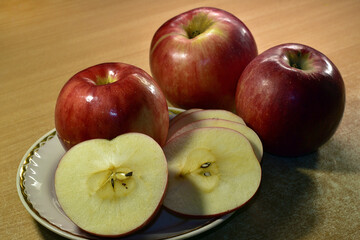 Naklejka na ściany i meble Ripe large red apples on the table.