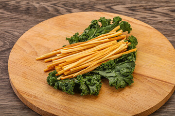 Chechel cheese sticks over board