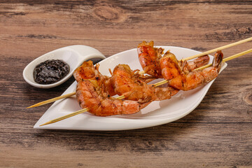 Grilled prawn skewer with pepper sauce