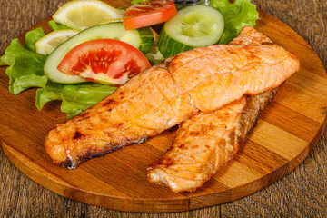 Grilled salmon served vegetables and lemon