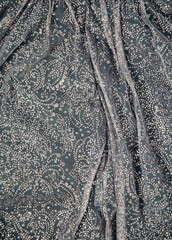 Silver colored sequins pattern texture fashion background close up beautiful sparkling glitters dress
