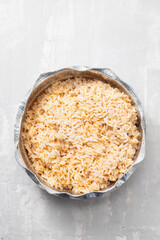 boiled rice in box take away on ceramic background
