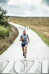 Fototapeta premium man running to 2021 new year