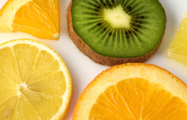 Fototapeta na wymiar Fruit slices: lemon, orange, kiwi