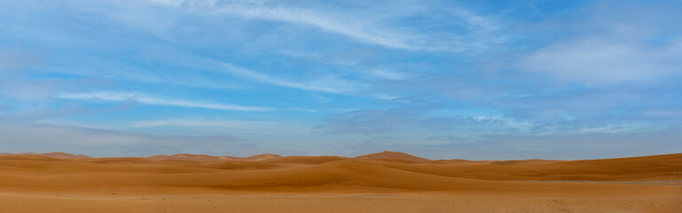 Middle East orange sand dunes desert panorama 