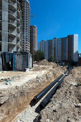 Laying of pipelines, communications. Construction site. Production of apartments, social housing.