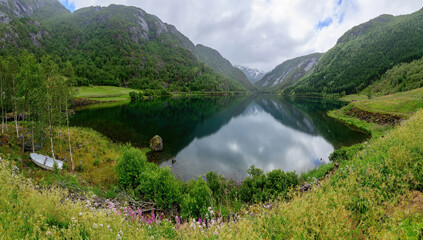 A reflection of the mountains in a fjord, Scandinavia, Norway