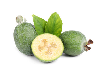 Cut and whole feijoas with leaves on white background