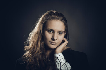 Studio portrait of young beautiful longhaired woman