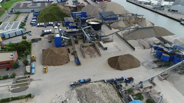 Aerial birds eye view of concrete plant also known as concrete-batching factory is equipment that combines various ingredients to form the end product showing the mixers batchers conveyors and silos