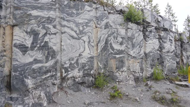 Marble rock deposits water canyon, landscape rocks with reflection. Beautiful and majestic nature of the stones. Geology the quarry raw.