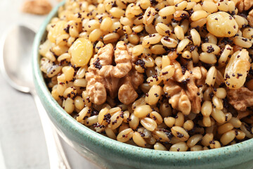 Traditional Christmas slavic dish kutia in bowl on table, closeup