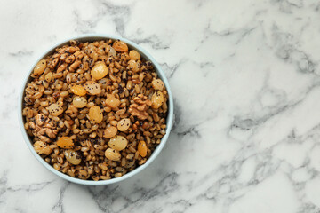 Traditional Christmas slavic dish kutia on white marble table, top view. Space for text
