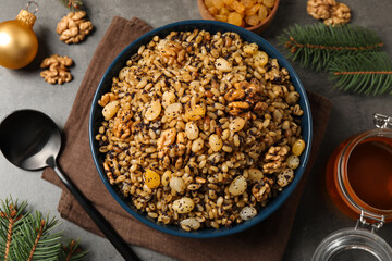 Traditional Christmas slavic dish kutia served on grey table, flat lay
