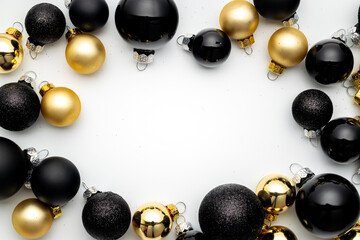 Christmas background. Gold Christmas baubles decoration on white background with copy space. Winter holidays, New Year.
