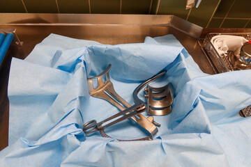 there is a surgical abdominal retractor in the instrument container