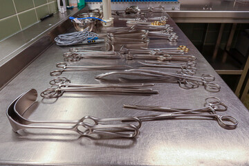 many Cleaned and disinfected instruments lie in a sterilization department of a hospital