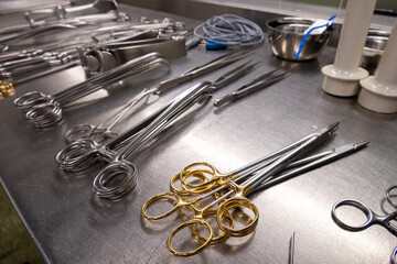 many Cleaned and disinfected instruments lie in a sterilization department of a hospital