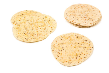 Pitta bread with seeds isolated on white