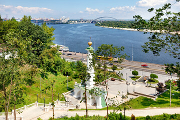 Beautiful landscape of summer Kyiv with a view of the Dnipro River and a monument to the Magdeburg...