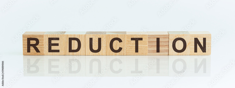 Aufkleber wooden blocks with the text: reduction. the text is written in black letters and is reflected in the
