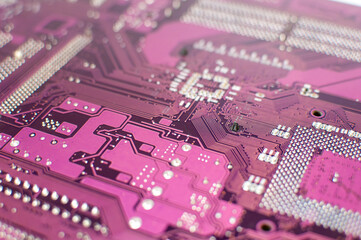 Close up of a printed purple computer circuit board