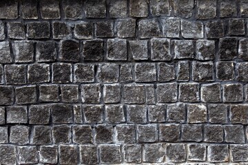 rough texture of gray granite bricks wall