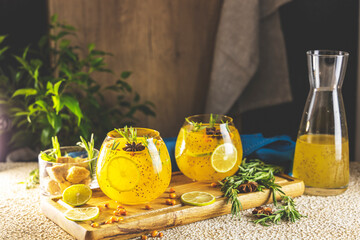 Sea buckthorn iced tea or lemonade with lime, rosemary, star anise and chia seeds. Tropical...