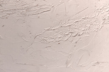 Old weathered stucco coated white wall image that can be used as background and covering with copy space