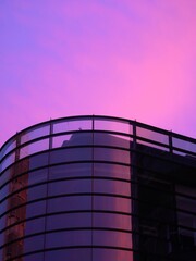 Glass building and pink sky