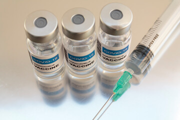 Laboratory Injection Vials with Covid-19 coronavirus vaccine and syringe