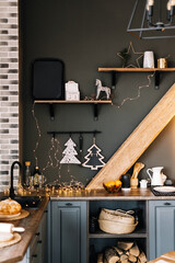 Modern kitchen interior with Christmas decorations.