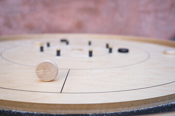 Crokinole table with the white piece on it's side