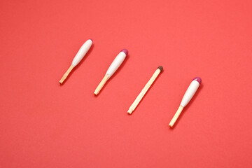 waterproof matches and simple match on red background
