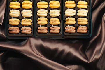  boxes with macarons in different colors