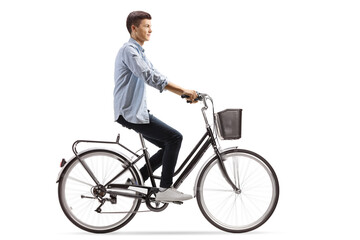 Profile shot of a casual guy riding a bicycle