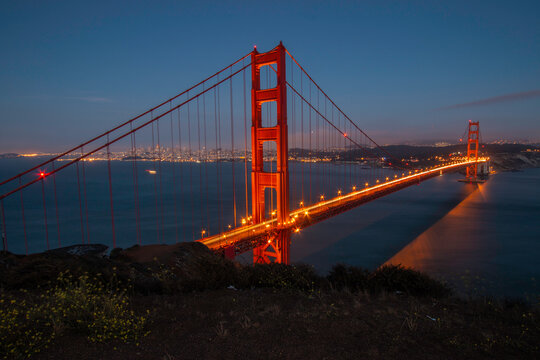 Night image of the Golden Gate Bridge spanning across the San Francisco Bay
