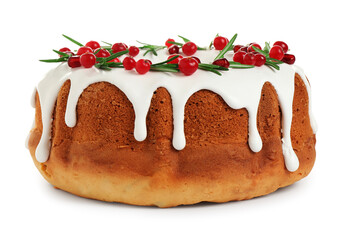 Traditional Christmas cake decorated with glaze, pomegranate seeds, cranberries and rosemary isolated on white