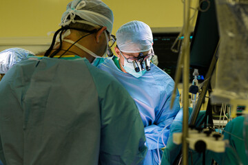 Surgeons in the operating room do operation