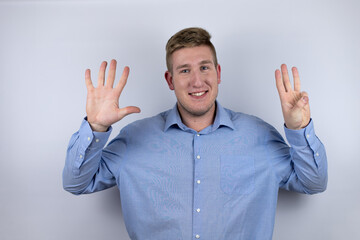Fototapeta premium Business young man wearing a casual shirt over white background smiling confident and happy showing number eight with fingers