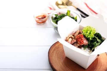 Se'i Sapi or  Beef Sei is Indonesia Traditional Smoked Beef, Served with Boiled Cassava Leaves and Sambal Luat or Sambal Matah. Typically Food from Nusa Tenggara, Indonesia