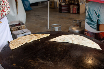 Womens are cooking delicious  national Turkish food - Gozleme. Old and Traditional Turkish fast food. Iftar dishes