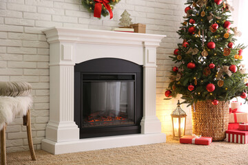 Beautiful living room interior with decorated Christmas tree and modern fireplace