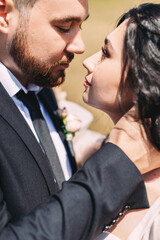 Wedding couple close-up portrait on the background of a field of natural landscape