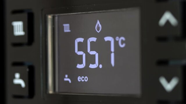 Control panel with display of the working gas boiler for hot water and heating. The smart control panel household gas boiler, close up.