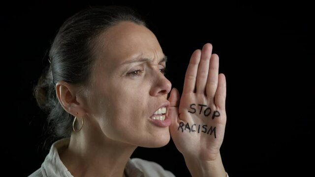 International racism move. A woman sctream to stop the racism on the black background.
