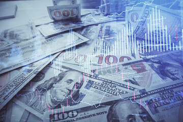 Multi exposure of forex chart drawing over us dollars bill background. Concept of financial success markets.