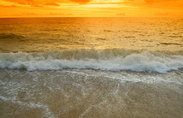 Fototapeta na wymiar Brown sand beach and sunset sky fresh and relax nature background