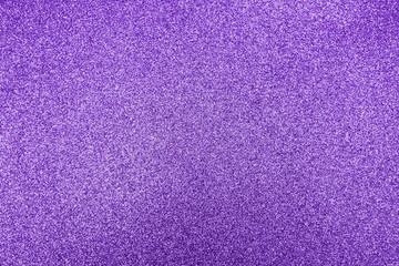Closeup of purple glitter texture. Photo of sparkle dust background.