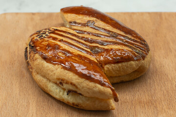 Turkish pastry product - pogaca. Close up of tasty, delicious, fresh pogaca with cheese (turkish: peynirli pogaca) on the table. Traditional turkish breakfast (turkish: turk kahvalti).